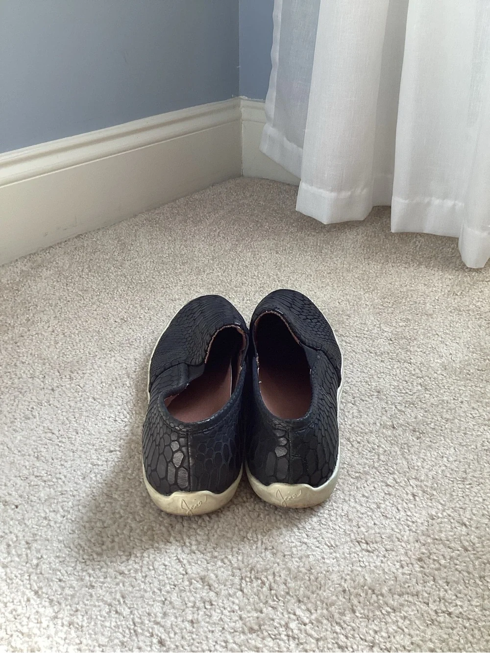 Joie Kidmore Slip-On Sneaker in a black snake-embossed leather